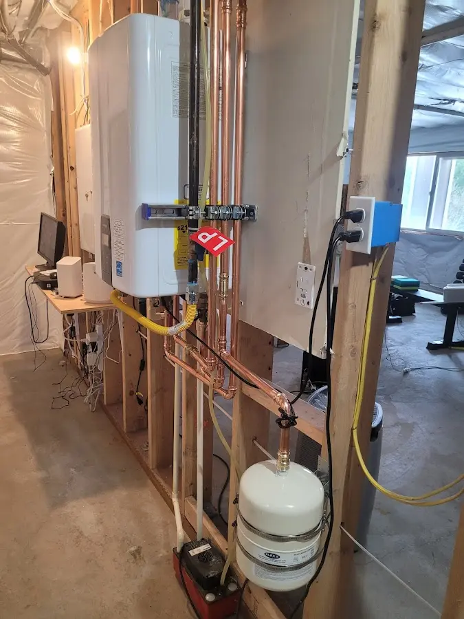 Licensed plumber repairing a kitchen sink in Bartonsville